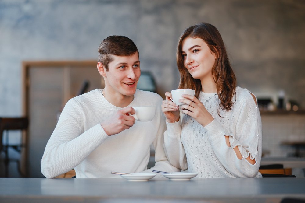 Couple talking openly and listening to each other over coffee