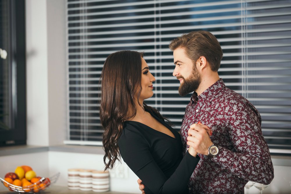 Married couple sharing a meaningful conversation at home